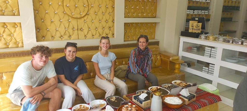 OmanTour guests enjoying traditional Omani food and halwa tasting