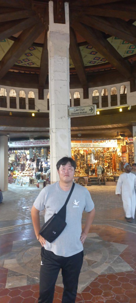 Tourist at Mutrah Souq entrance Muscat Oman