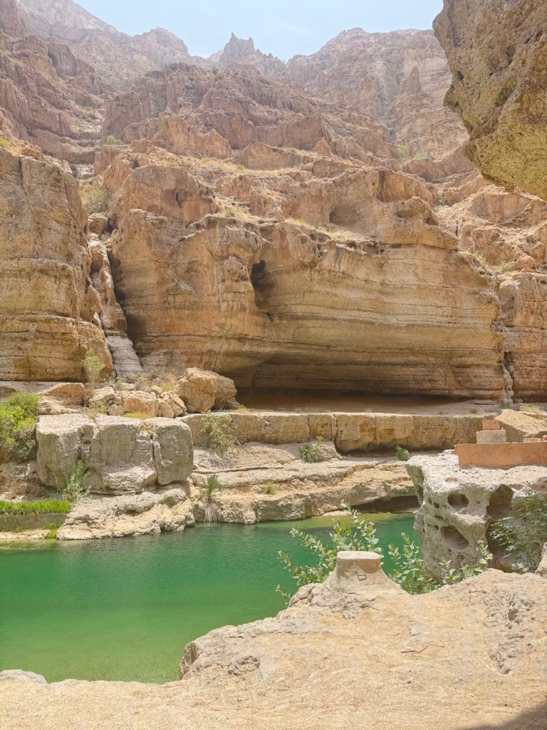 Hidden waterfall cave inside Wadi Shab canyon Oman