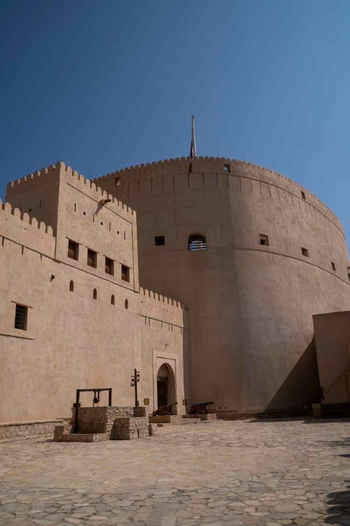 Nizwa Fort in Oman under clear December sky — warm country winter sightseeing